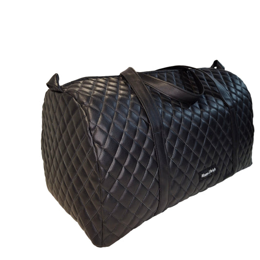 Black quilted bag on a white background