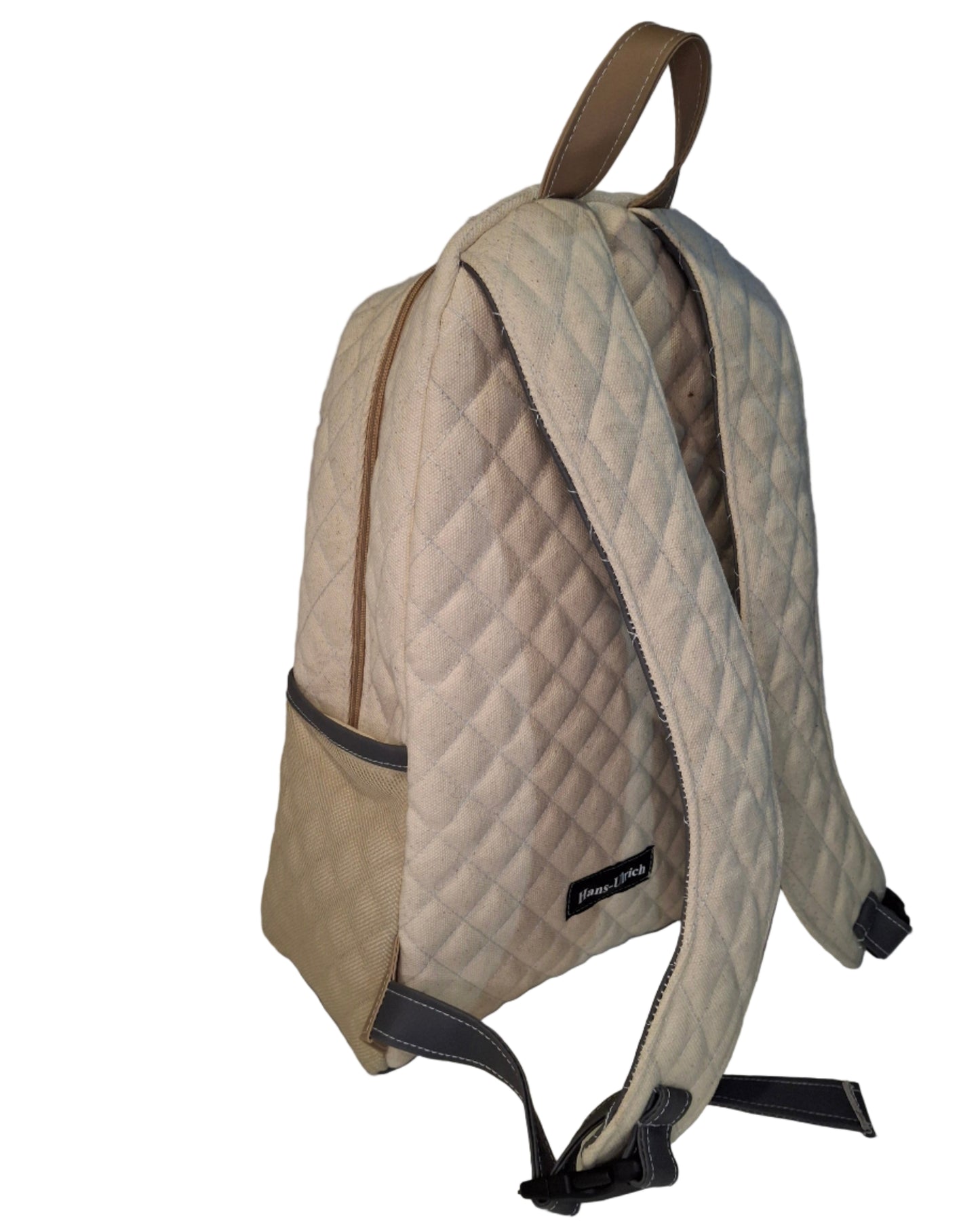 Beige quilted bag with a visible brand label on a white background