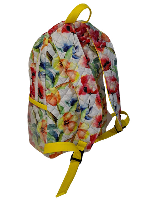 Floral-patterned bag with yellow straps on a white background