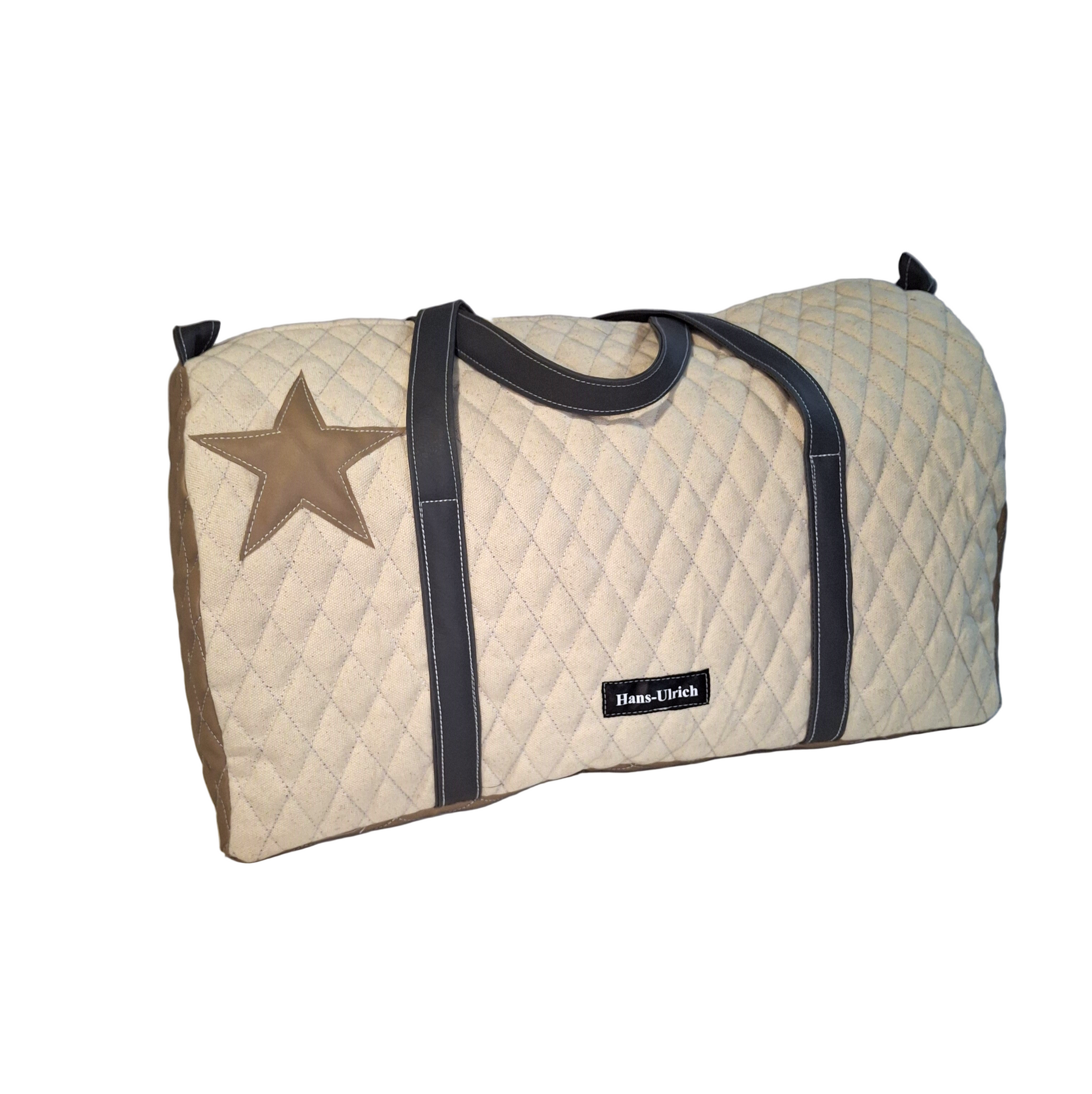 Beige quilted duffel bag with star design and black straps on a white background